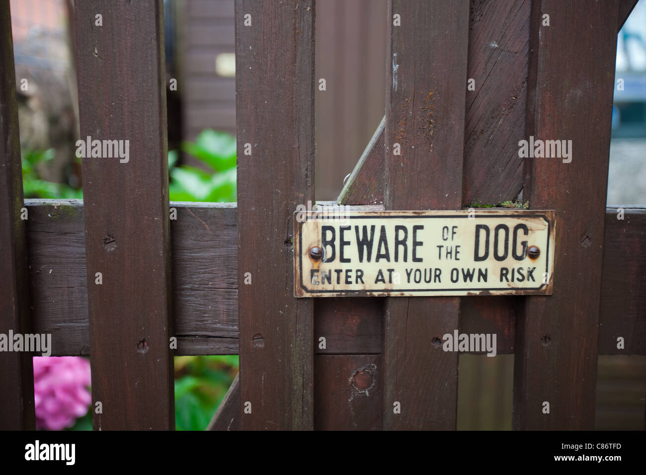Beware of the dog sign on a gate Stock Photo