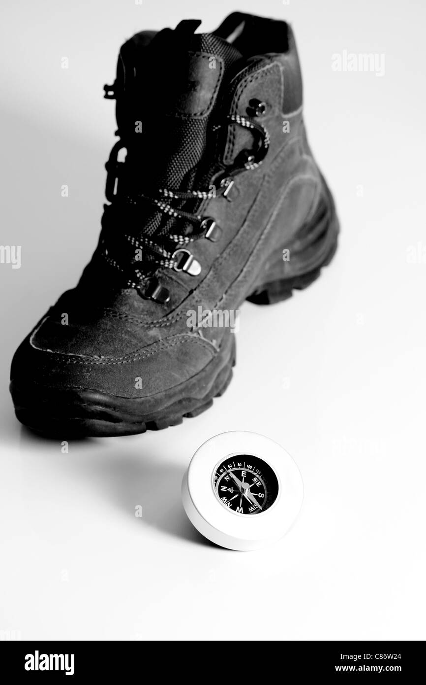 A hiking boot with compass Stock Photo Alamy