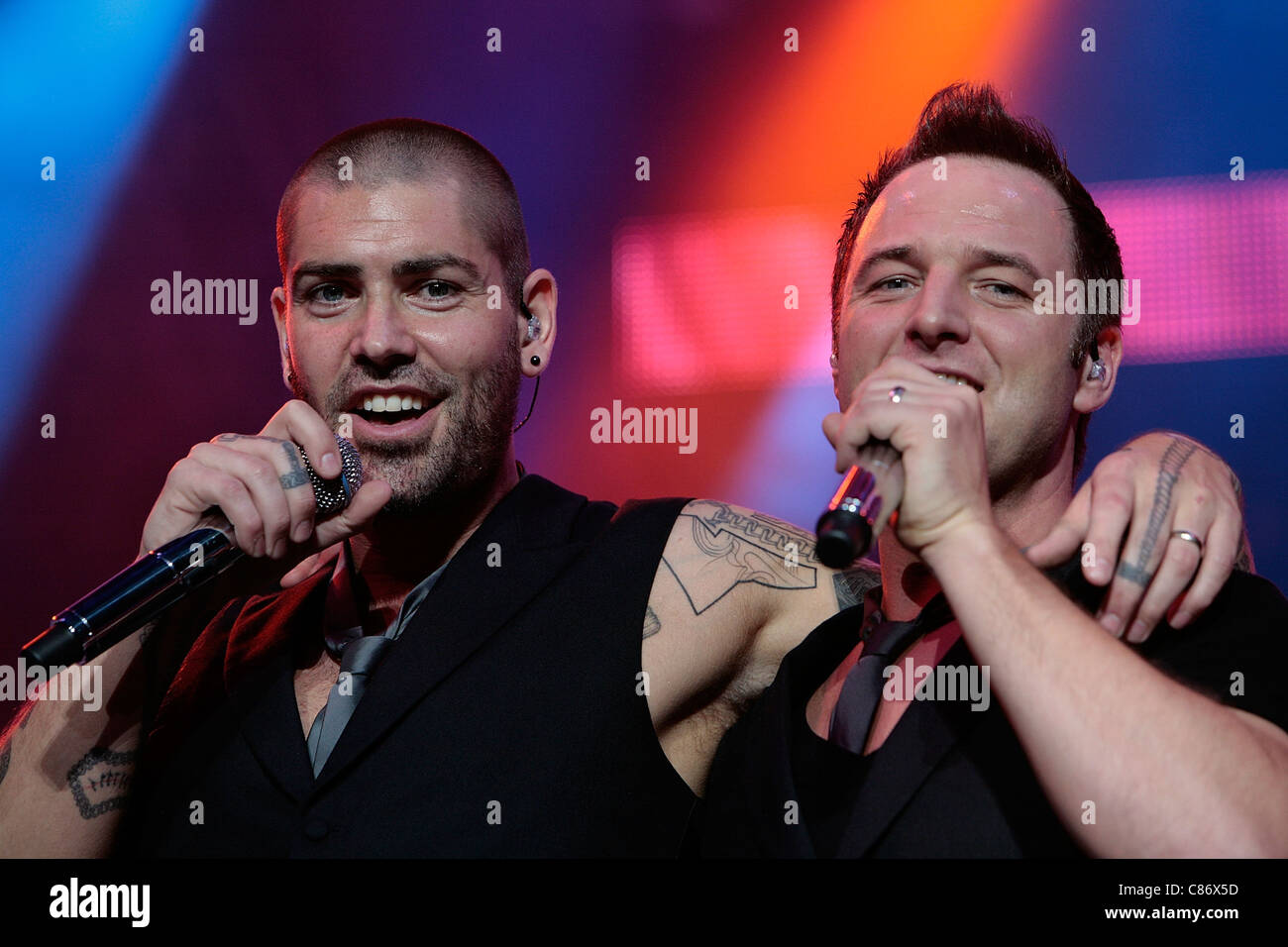 BELFAST, UNITED KINGDOM - MAY 25: Shane Lynch and Mikey Graham perform with Boyzone at the Odyssey Arena, Belfast Stock Photo