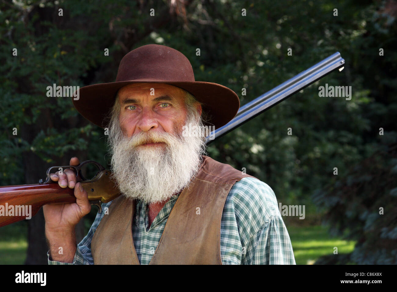 A cowboy with a rifle Stock Photo - Alamy