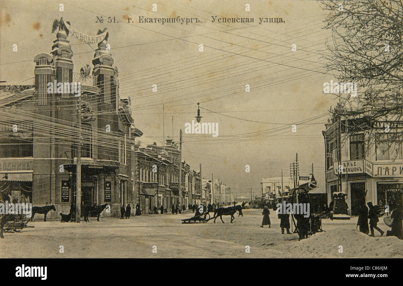 Uspenskaya Street in Yekaterinburg, Russian Empire. Black and white vintage photograph by Russian photographer Veniamin Metenkov dated from the beginning of the 20th century issued in the Russian vintage postcard published by Veniamin Metenkov himself in Yekaterinburg. Text in Russian: Yekaterinburg. Uspenskaya Street. Courtesy of the Azoor Postcard Collection. Stock Photo