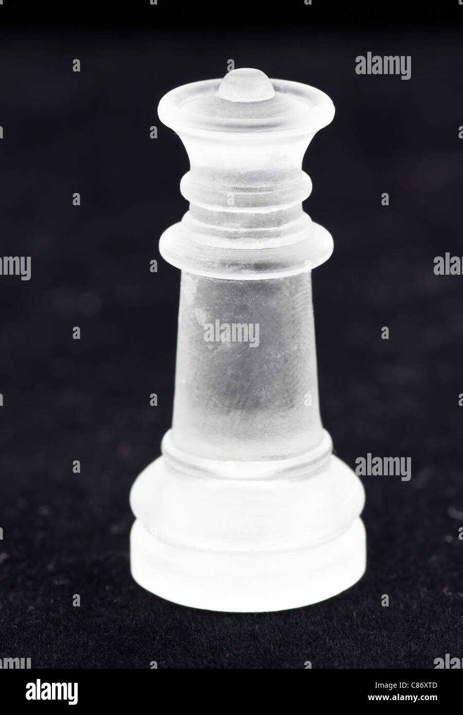 Queen chess piece made of tinted glass Stock Photo
