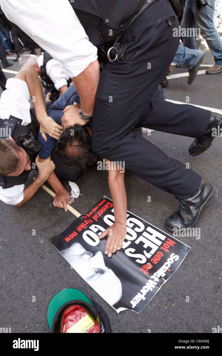 Police kettle a small group, some masked, on Whitehall after a peaceful