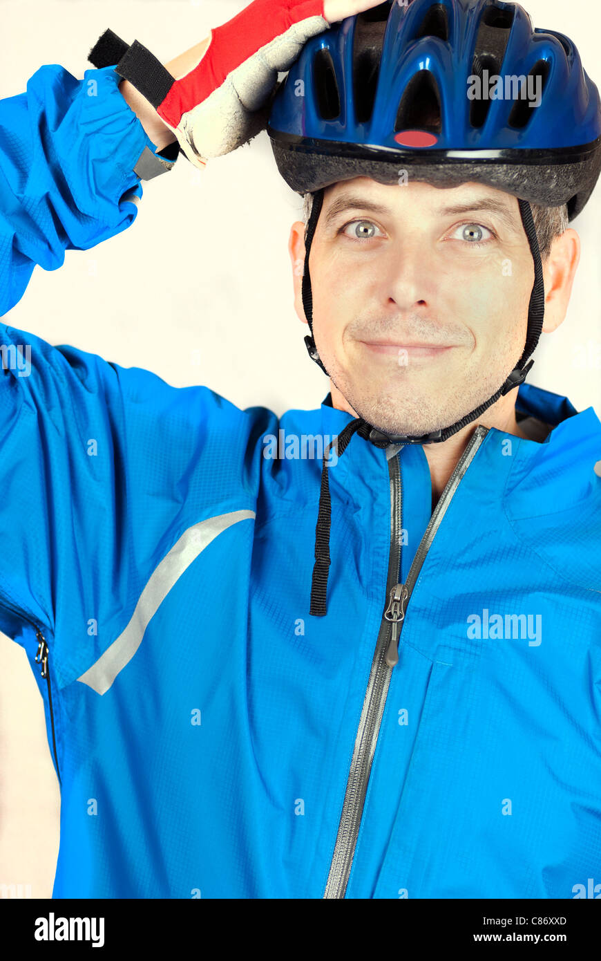 Close-up of a cyclist putting on his helmet. Stock Photo