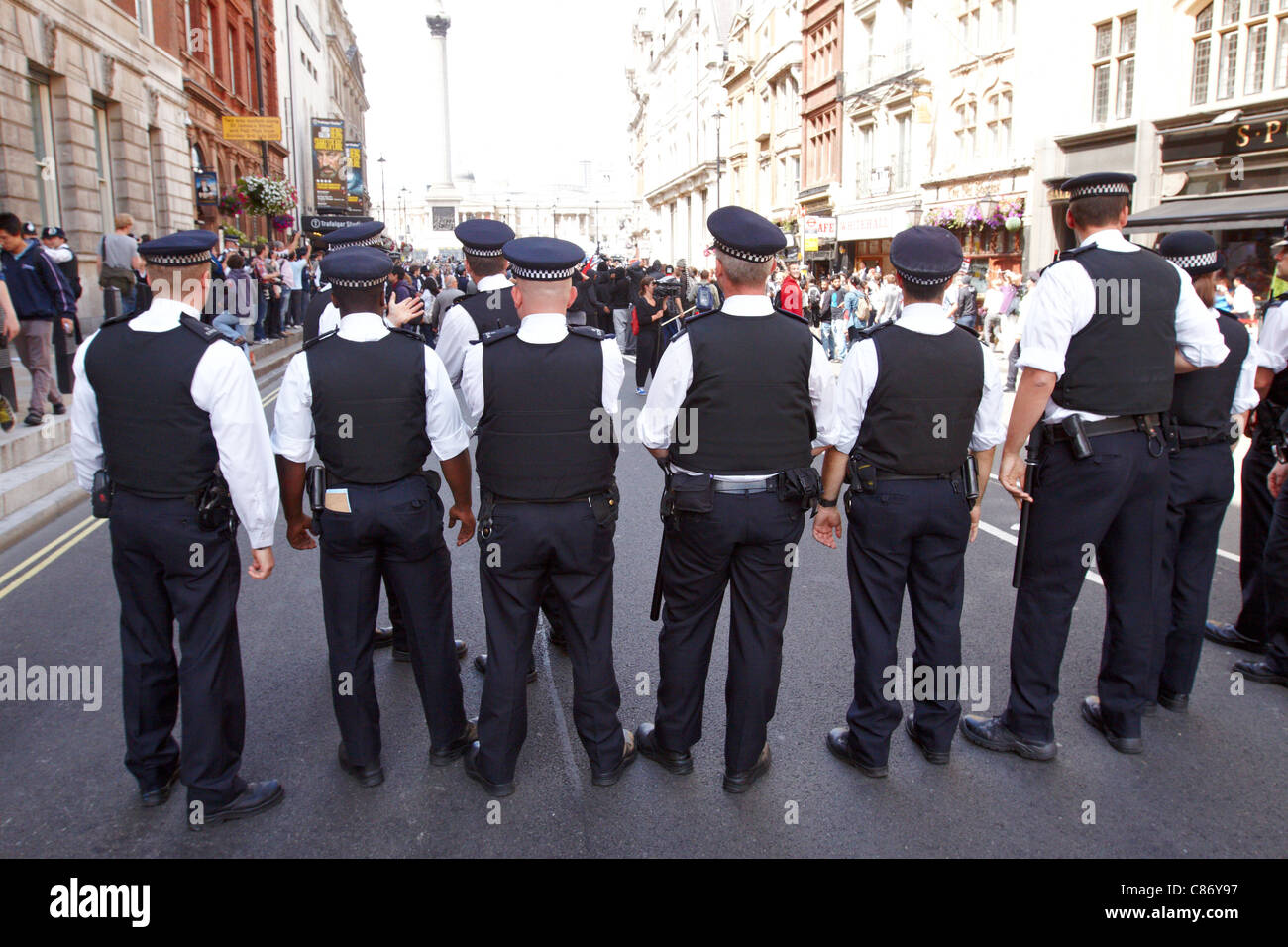 Police kettle a small group, some masked, on Whitehall after a peaceful
