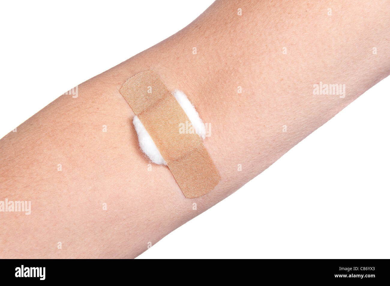 A person medically dressed with a cotton ball and bandage over a wound. Stock Photo