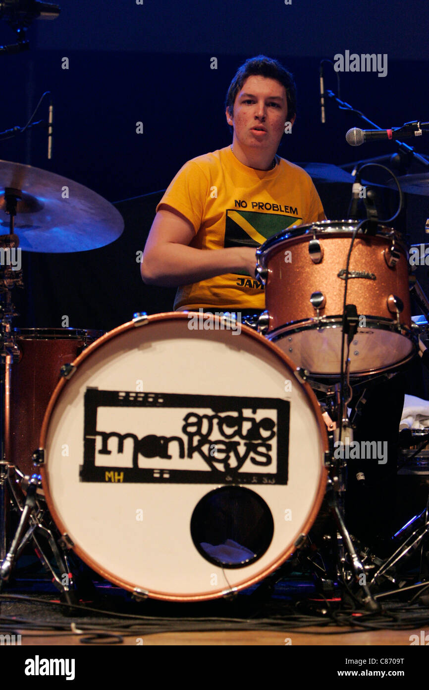 Matt Helders, drummer with the Arctic Monkeys performs on stage at the NME  Brat Pack Awards Tour, Ulster Hall, Belfast, Northern Ireland Stock Photo -  Alamy