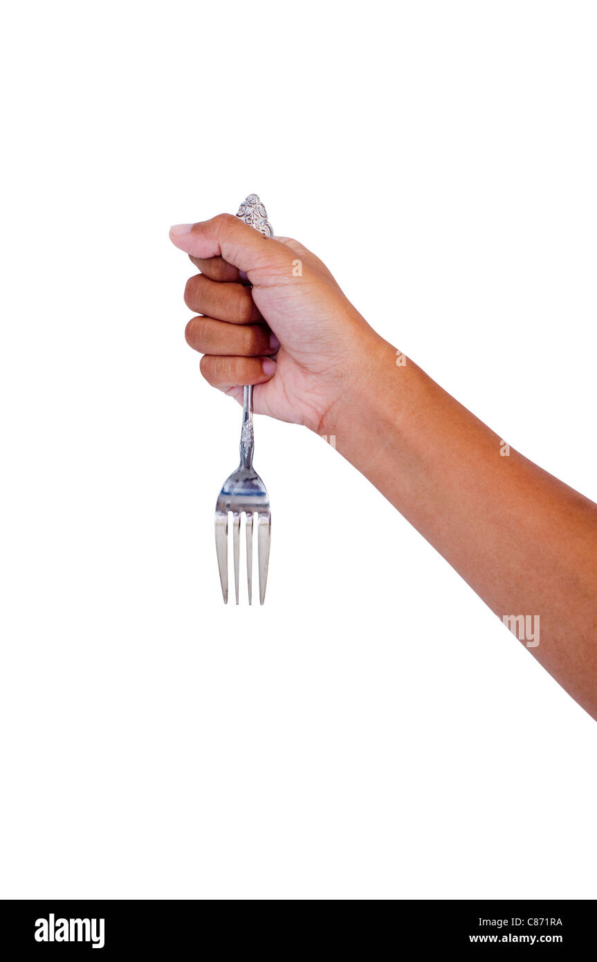 woman hand gripping a fork, isolated on background. For stabbing concept. Stock Photo