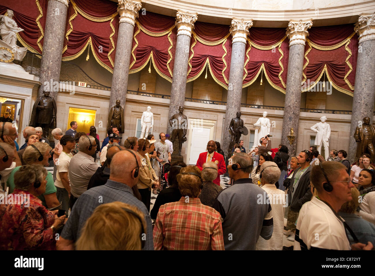 Visitors on a guided tour of the Capitol building, in the National Statuary Hall, Washington DC USA Stock Photo