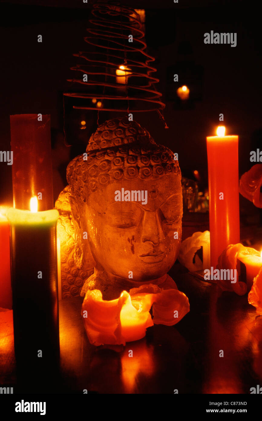 Buddhist shrine & candles Stock Photo Alamy