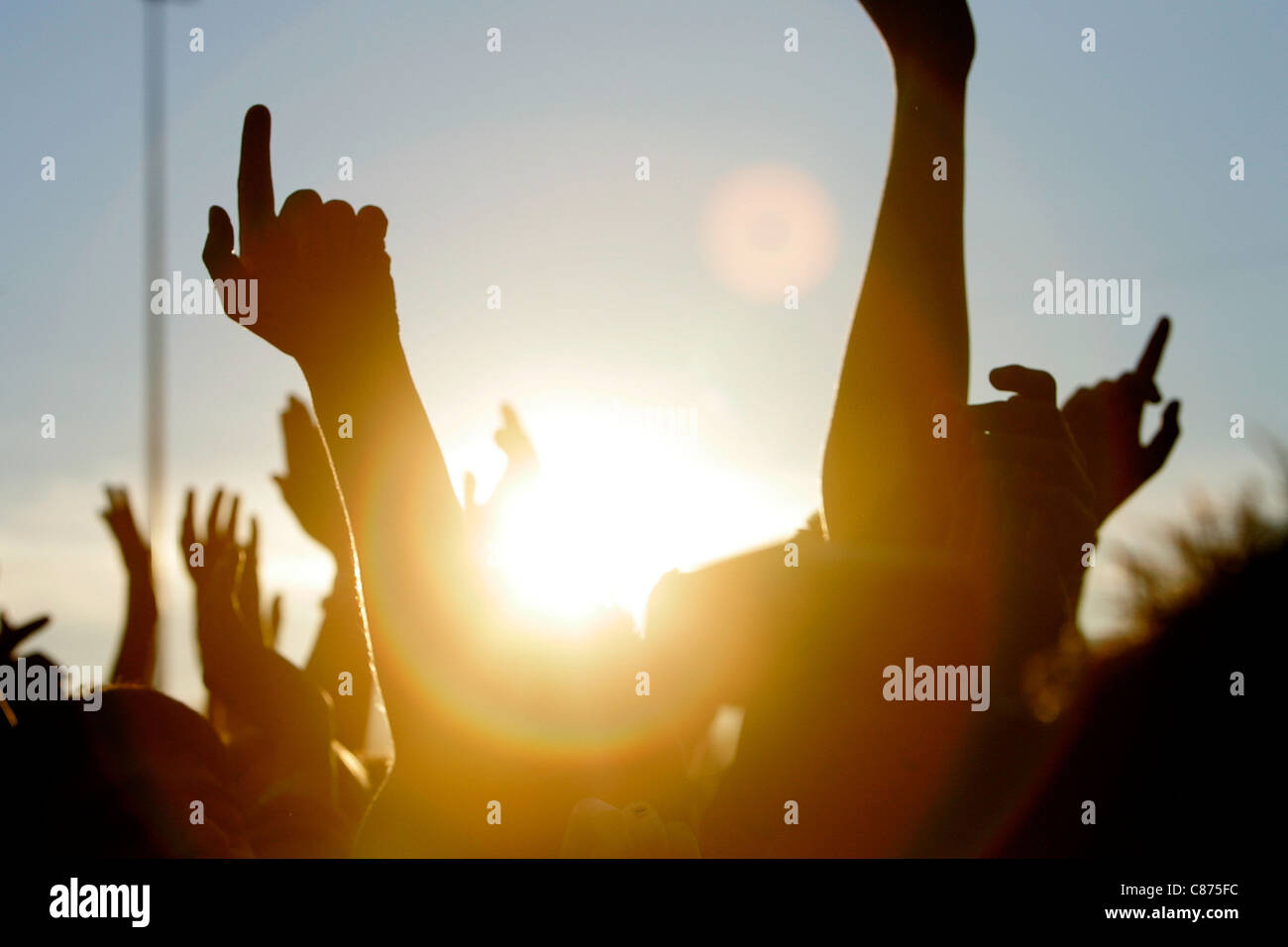 Concert crowd outside arms sunset hi-res stock photography and images ...