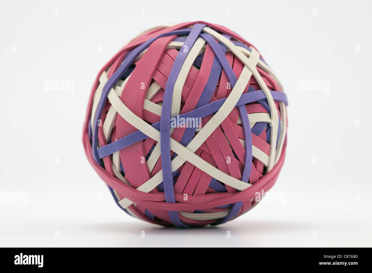 Rubber ball made from strips of elastic Stock Photo