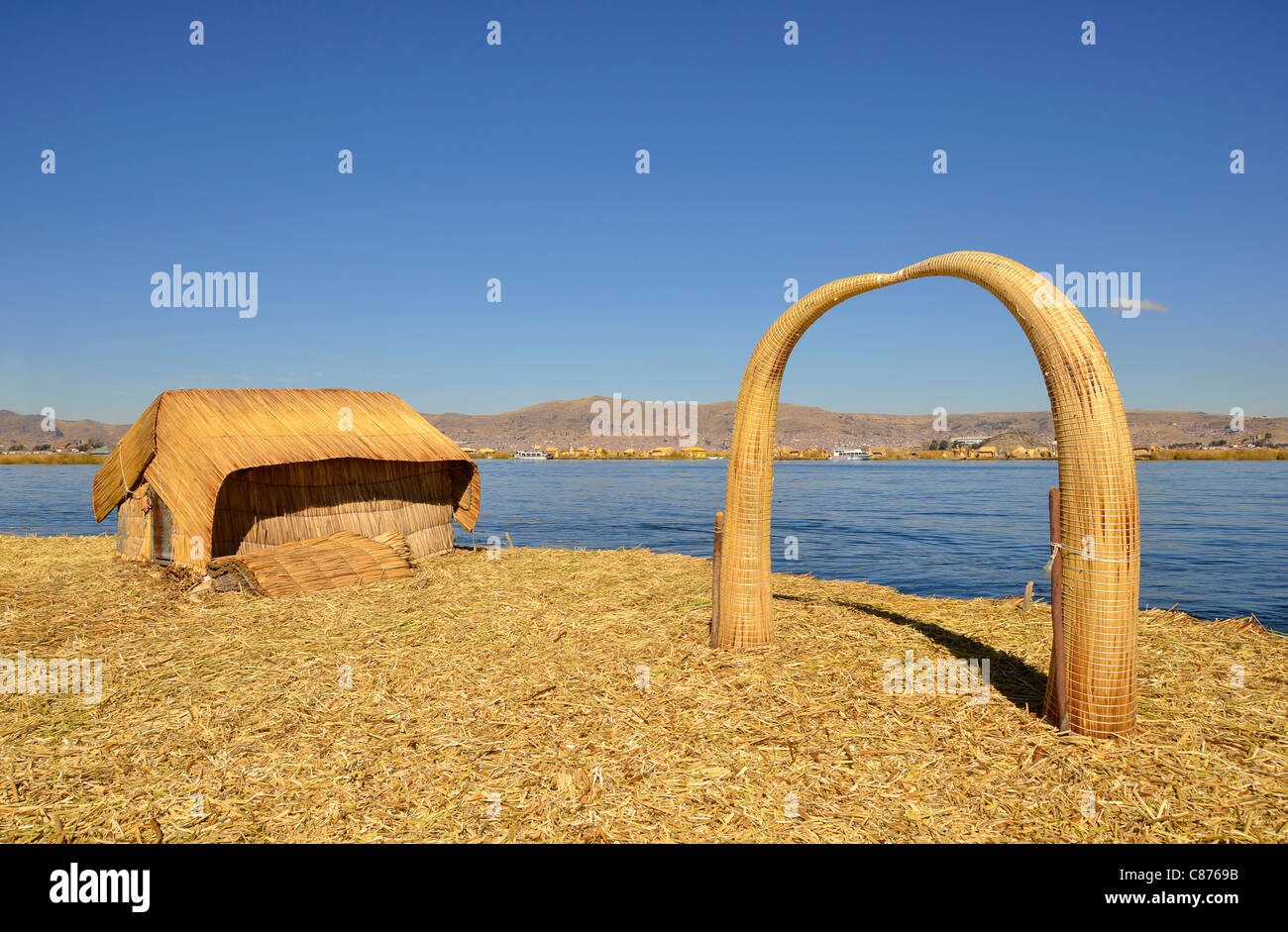 House and Arch Made of Reed on Uros Floating Island on Highest ...