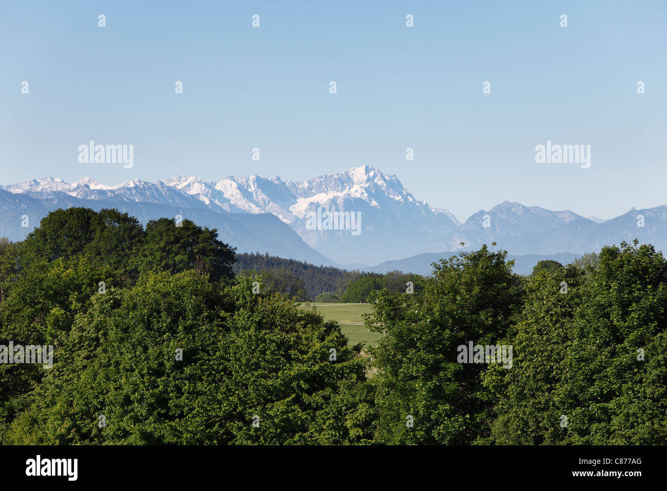 Germany, Bavaria, Upper Bavaria, Egling, View of forest landscape with Alps and Zugspitze mountains in background Stock Photo