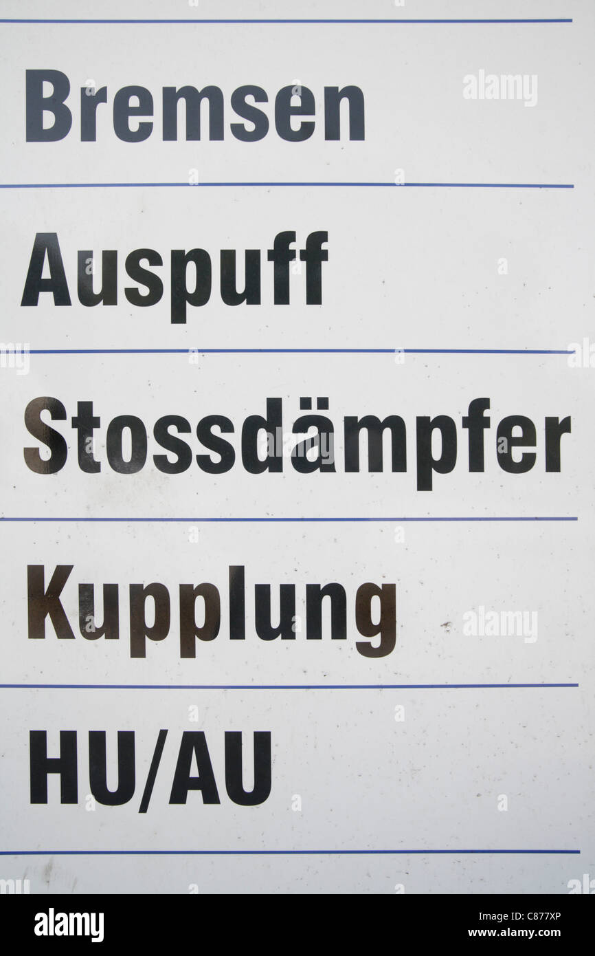 Germany, Ebenhausen, Close up of advertising board in repair garage Stock Photo