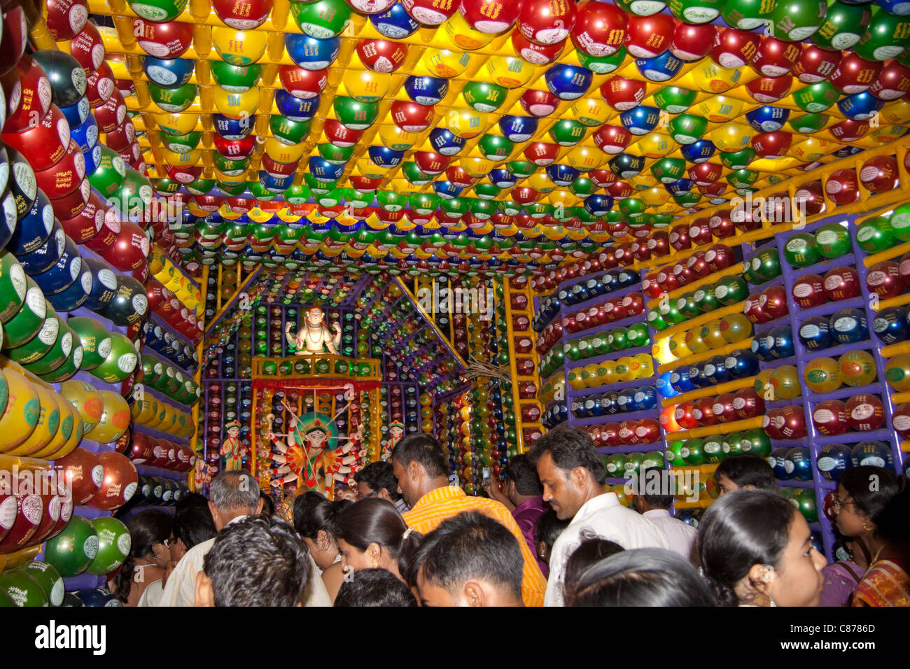 Devotees at 'Karbagan Durga Puja pandal' made of coloured plastic Stock ...