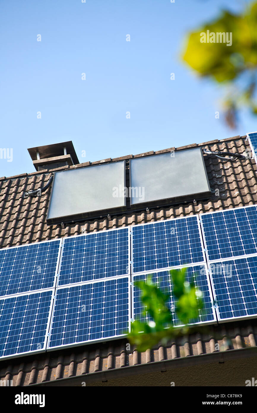 Germany, Cologne, House rooftops with different of solar panels Stock ...