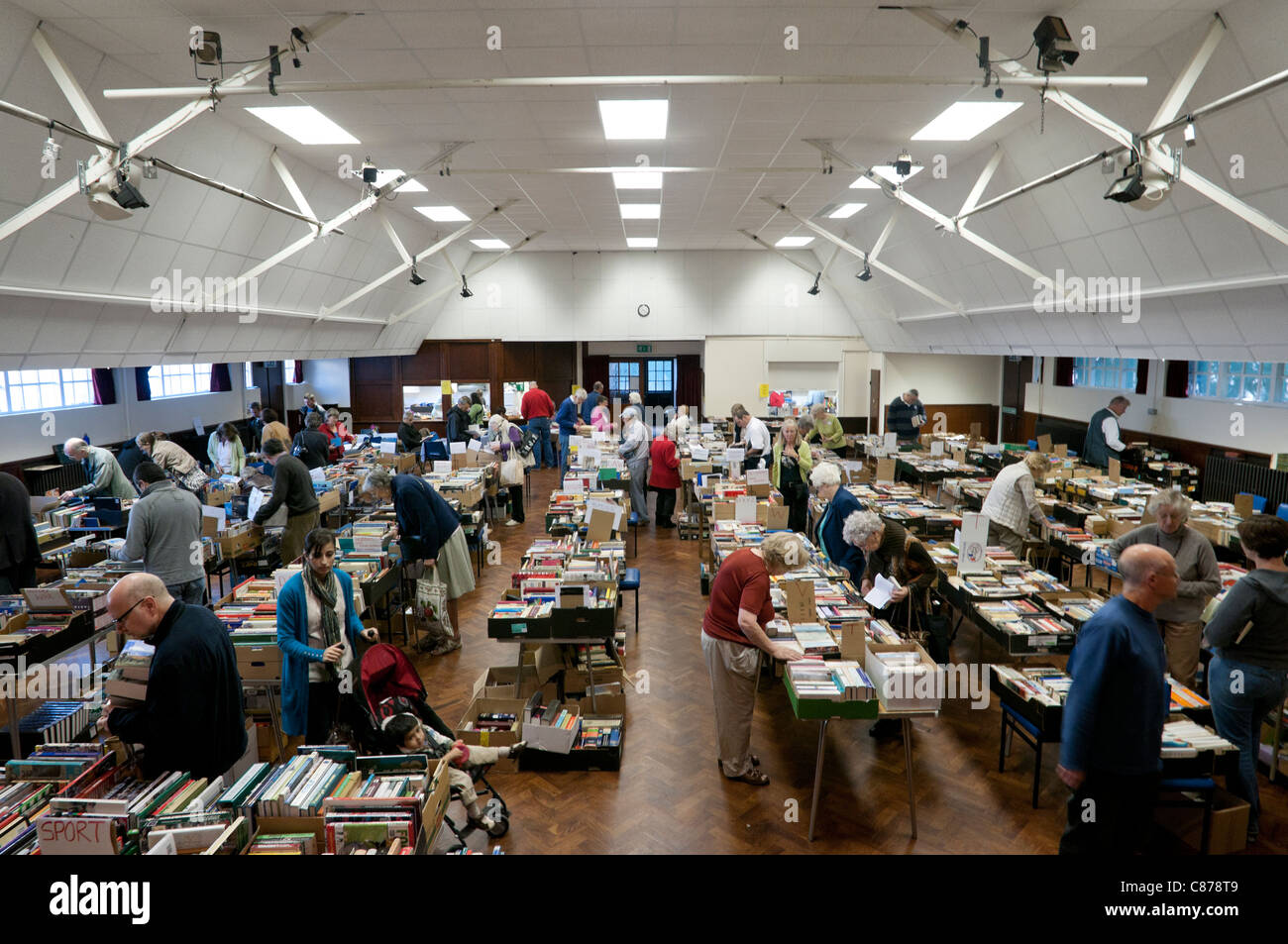 Charity book fair in a village hall in Surrey, UK Stock Photo