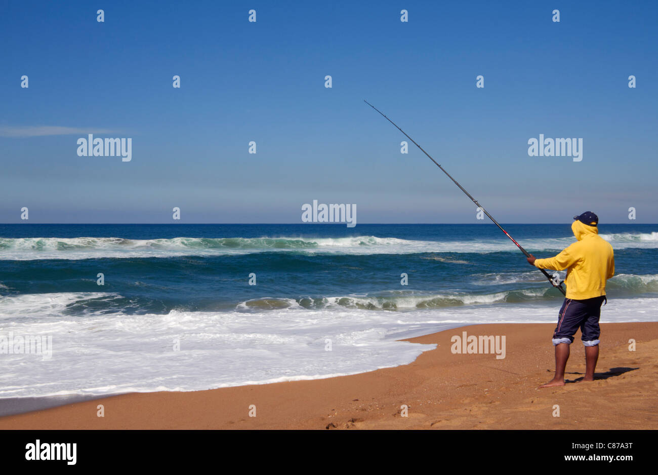 Fishing from the beach at Amanzimtoti, KwaZulu-Natal, South Africa. Stock Photo