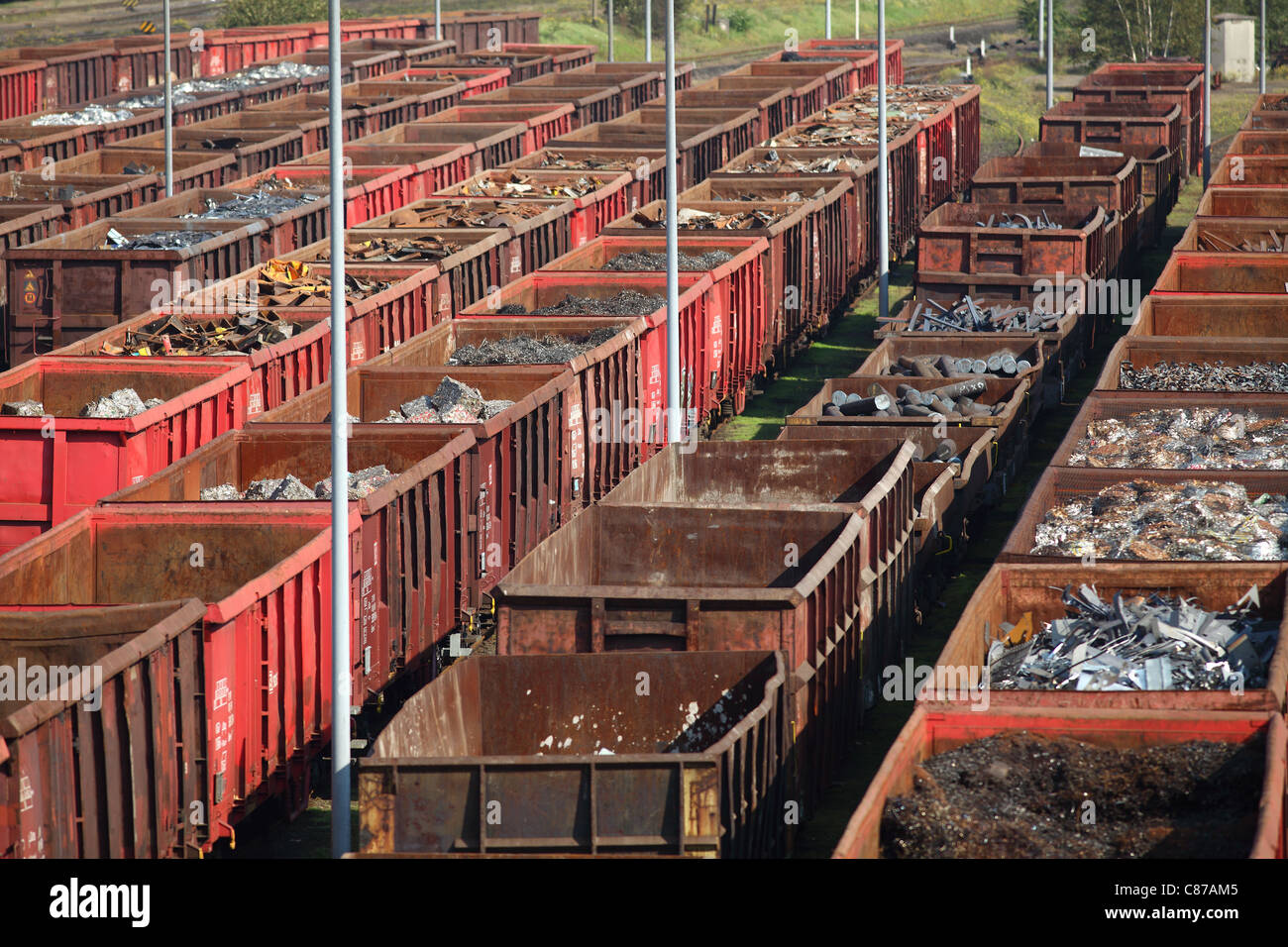 Freight depot, freight yard. Scrap metal in railway wagons, for melt down in a steelworks, recycling of old metal. Stock Photo
