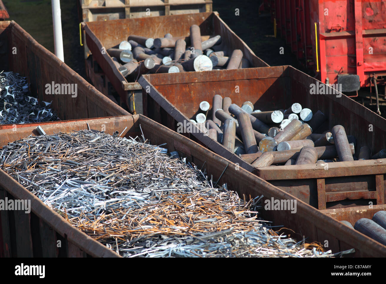 Freight depot, freight yard. Scrap metal in railway wagons, for melt down in a steelworks, recycling of old metal. Stock Photo