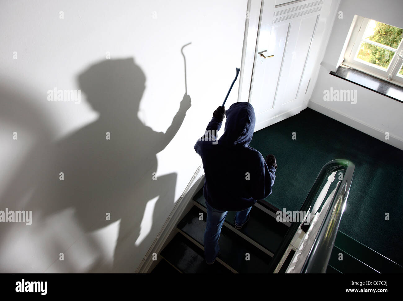 Burglar in a private house. Daylight burglary. Breaking into a house