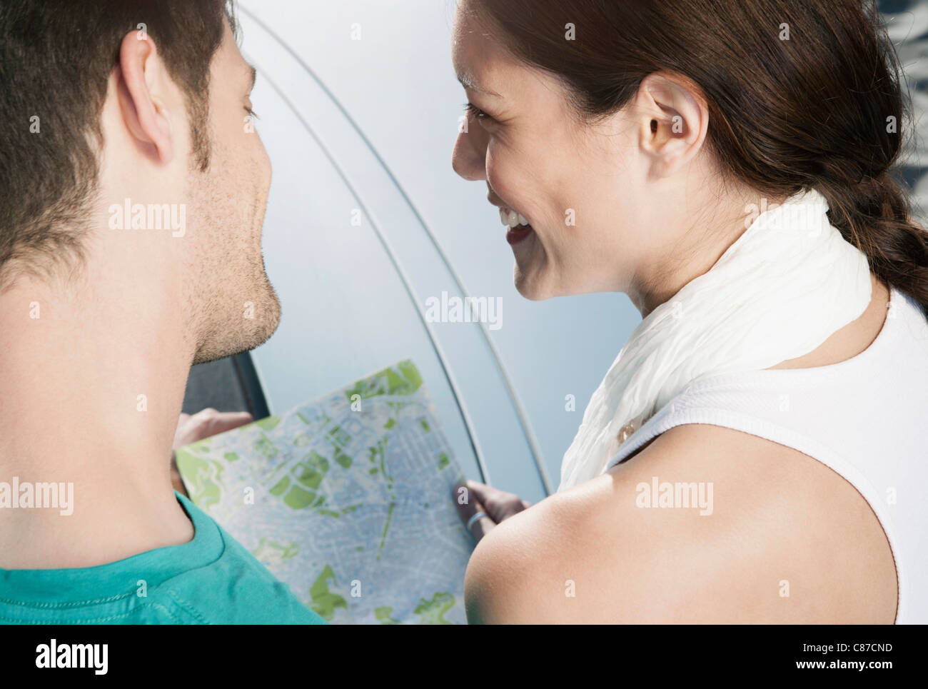 Spain, Majorca, Young couple holding map, smiling Stock Photo