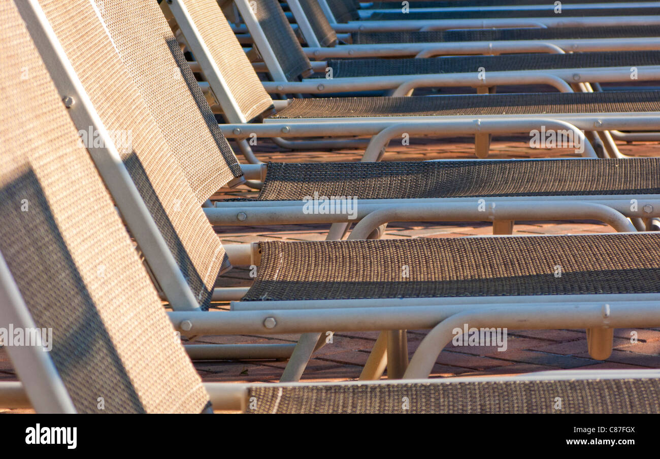 ABSTRACT SHALLOW FOCUS IMAGE OF EMPTY SUNBEDS Stock Photo