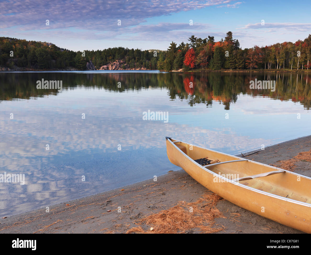 Canoe on a shore of George lake. Beautiful fall nature scenery. Killarney Provincial Park, Ontario, Canada. Stock Photo
