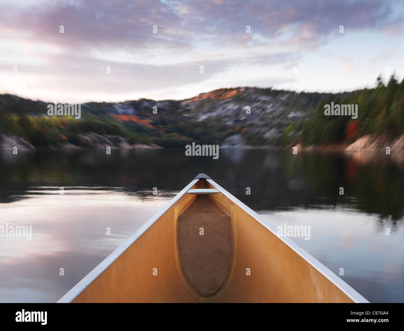 Canoeing at lake in fall. Killarney Provincial Park, Ontario