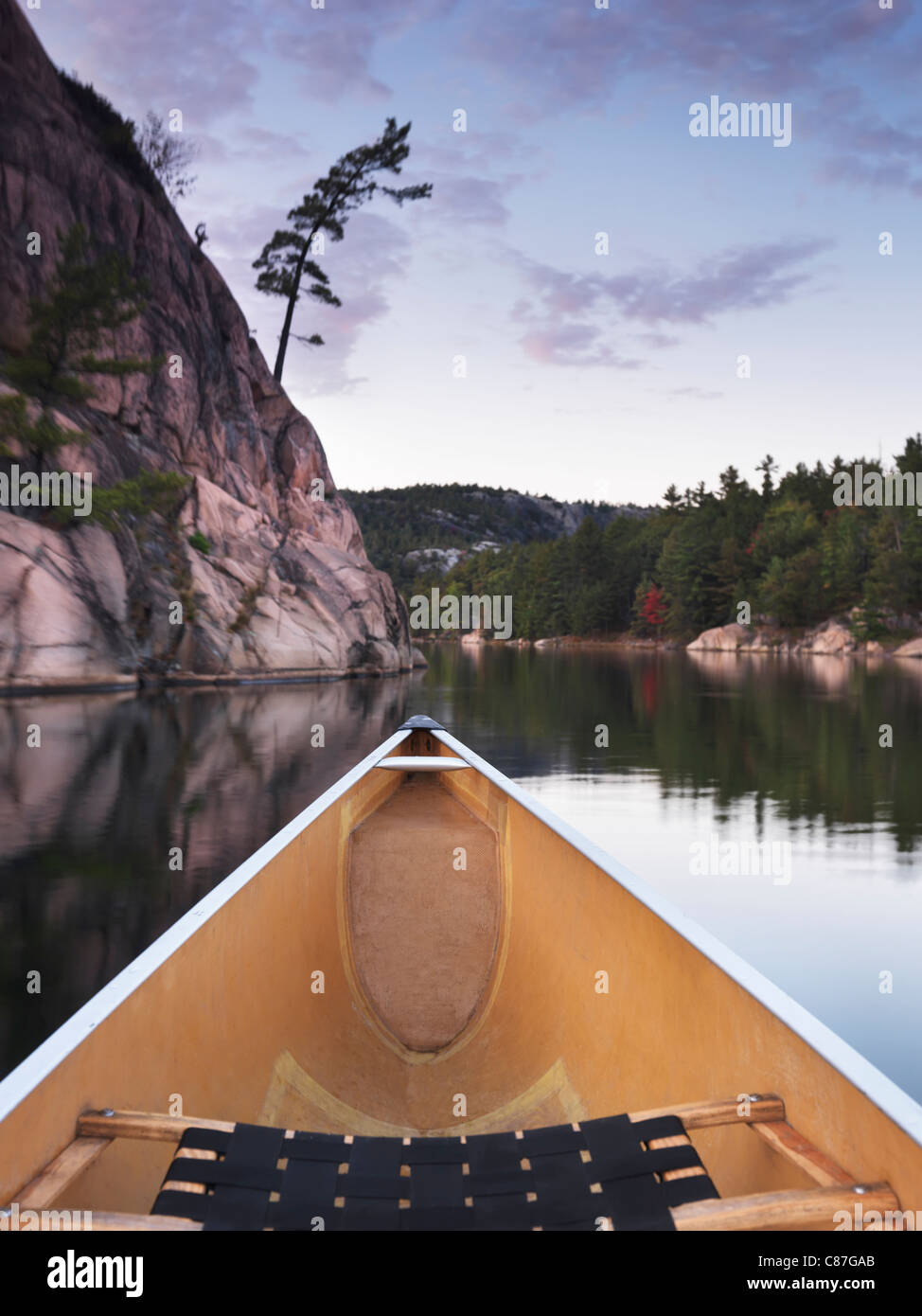 Canoeing on lake in fall. Killarney Provincial Park, Ontario