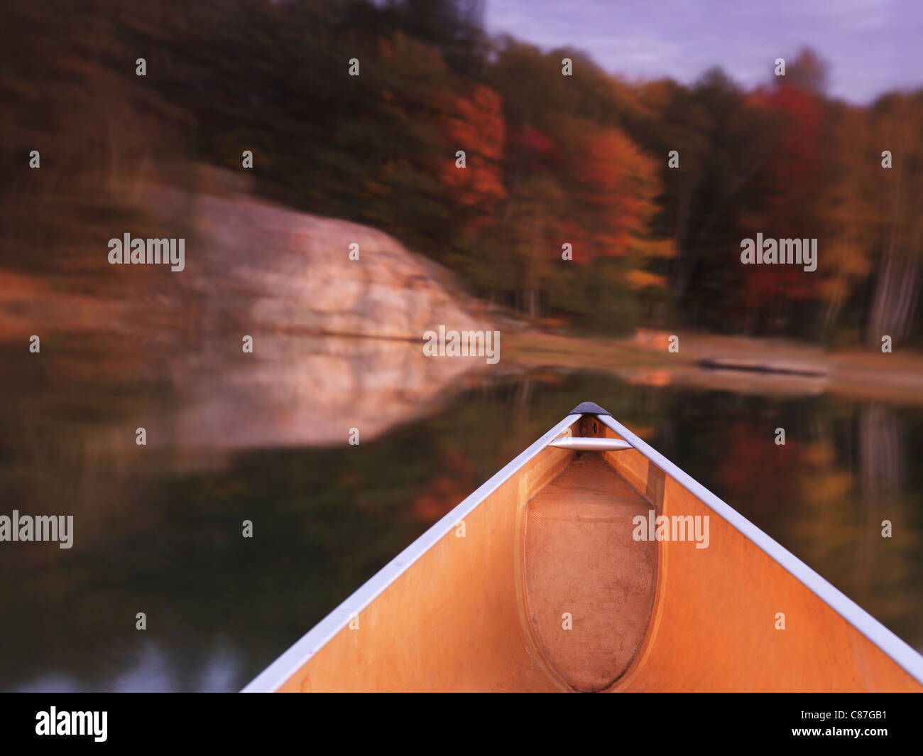 Canoeing on lake in fall. Killarney Provincial Park, Ontario