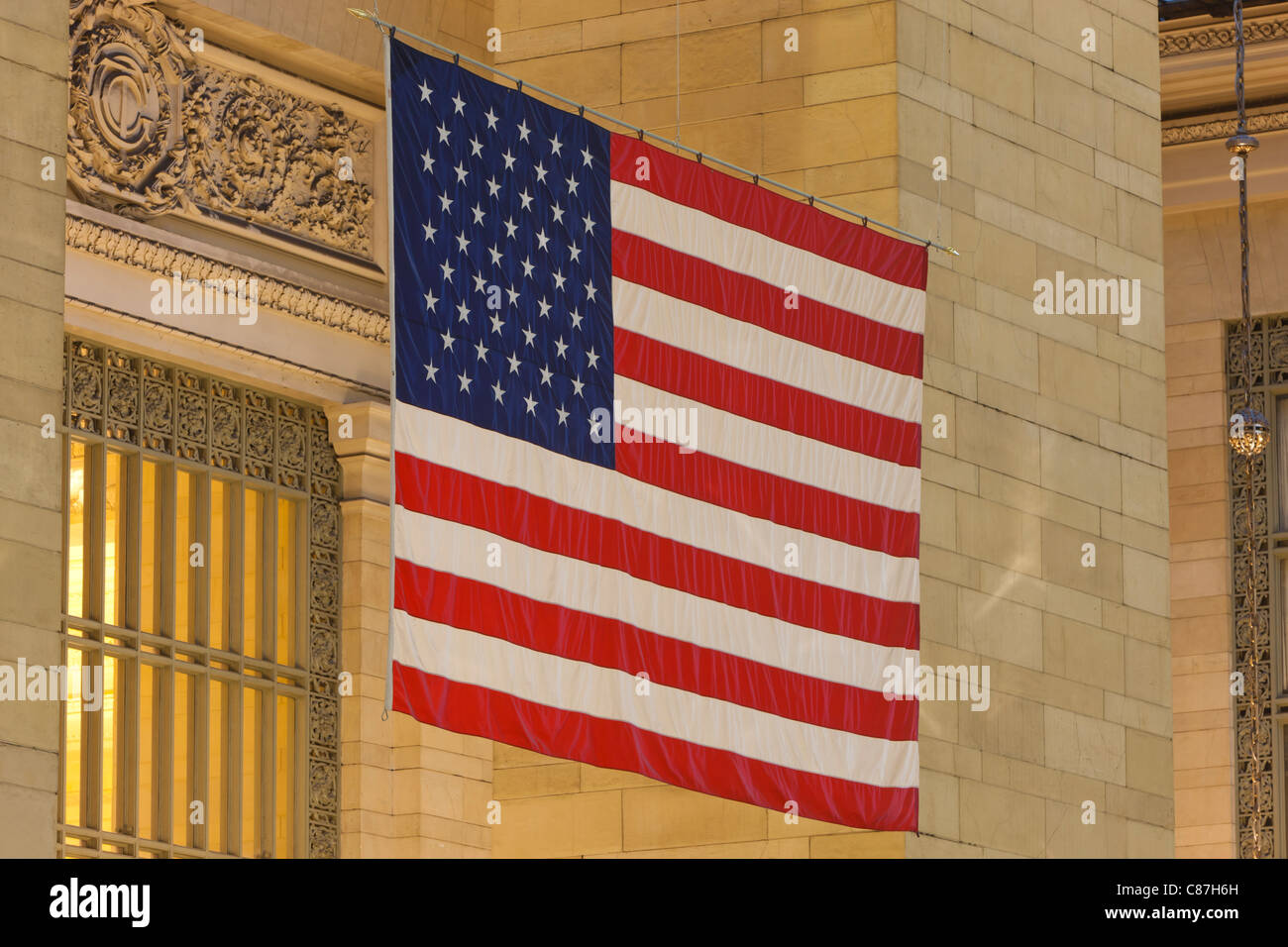 The large American flag hanging in Grand Central Terminal in New York City Stock Photo