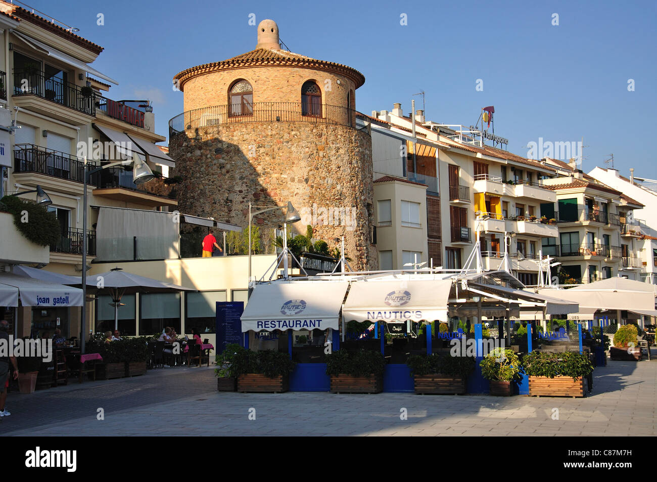 Torre del Port and restaurants on promenade, Cambrils, Costa Daurada, Province of Tarragona, Catalonia, Spain Stock Photo