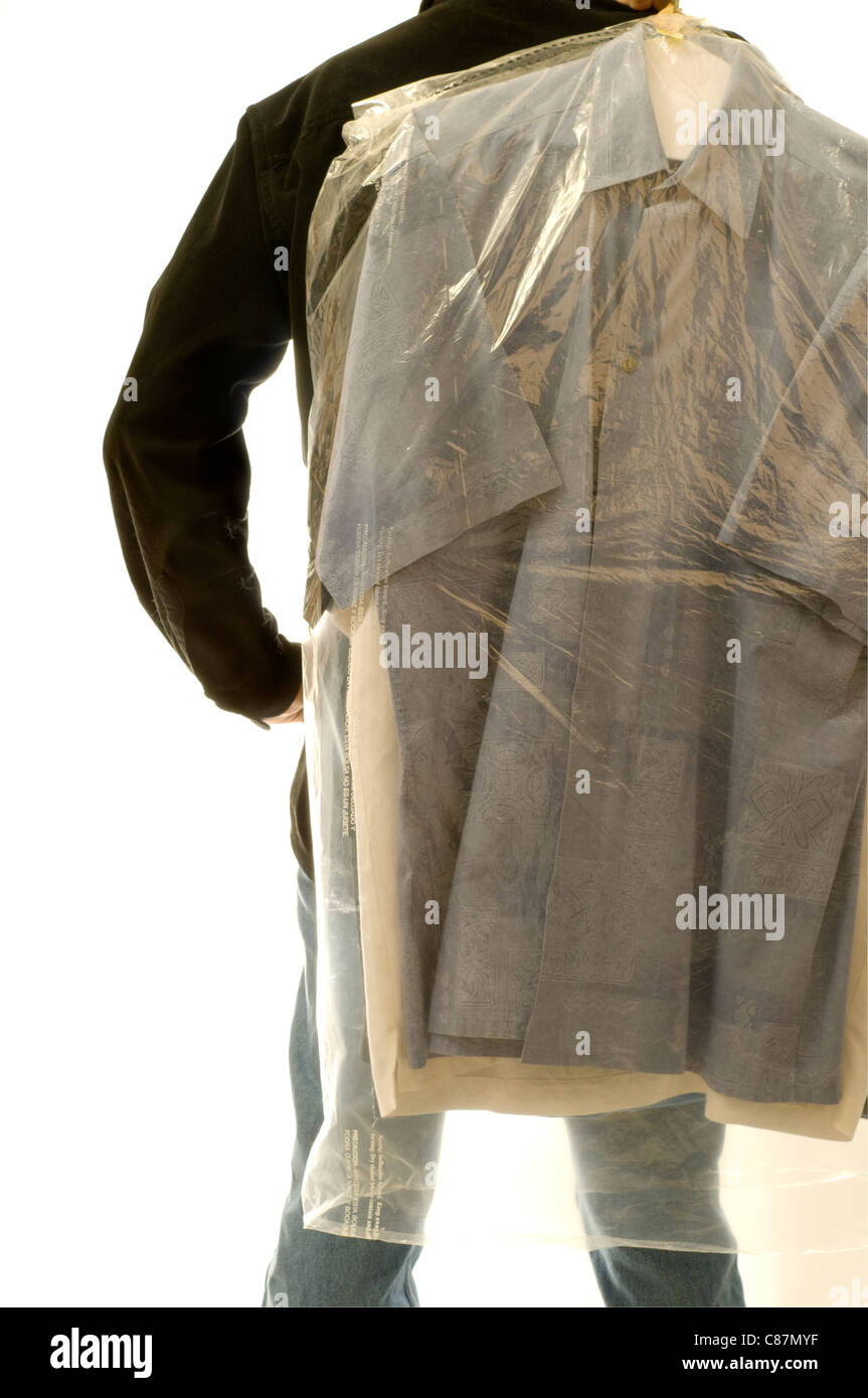 Rearview of man with dry cleaning bag. Stock Photo