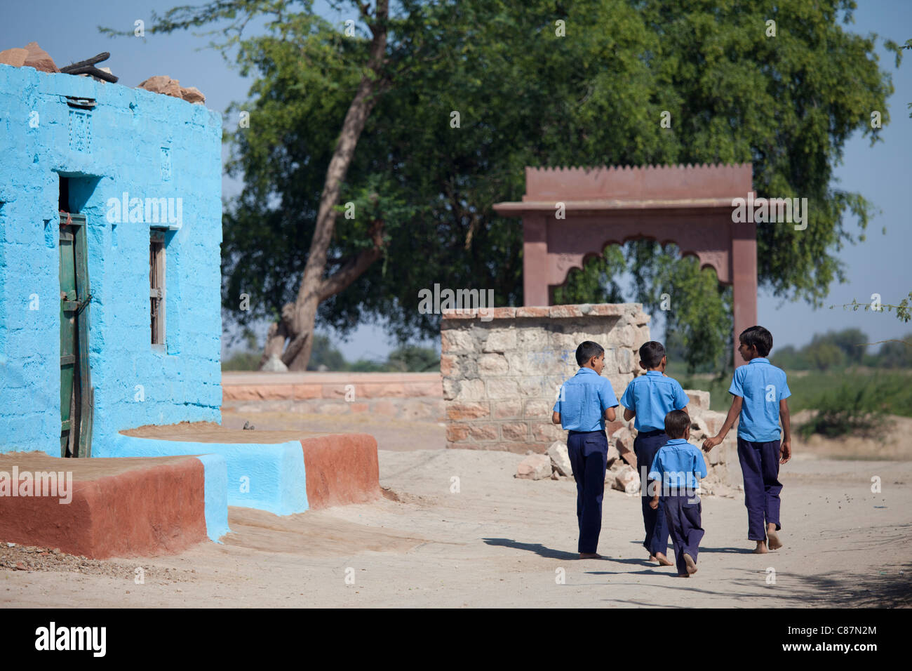 Boys in Hindu Brahman high caste village of Dhudaly heading for school in Rajasthan, Northern India Stock Photo
