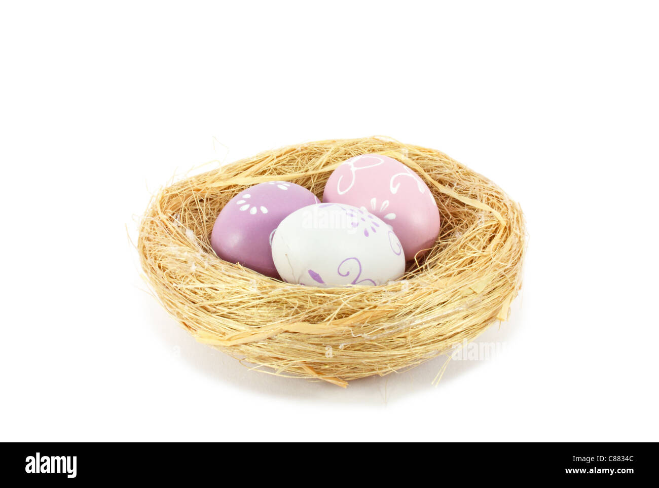 Eggs in nest isolated on white Stock Photo - Alamy