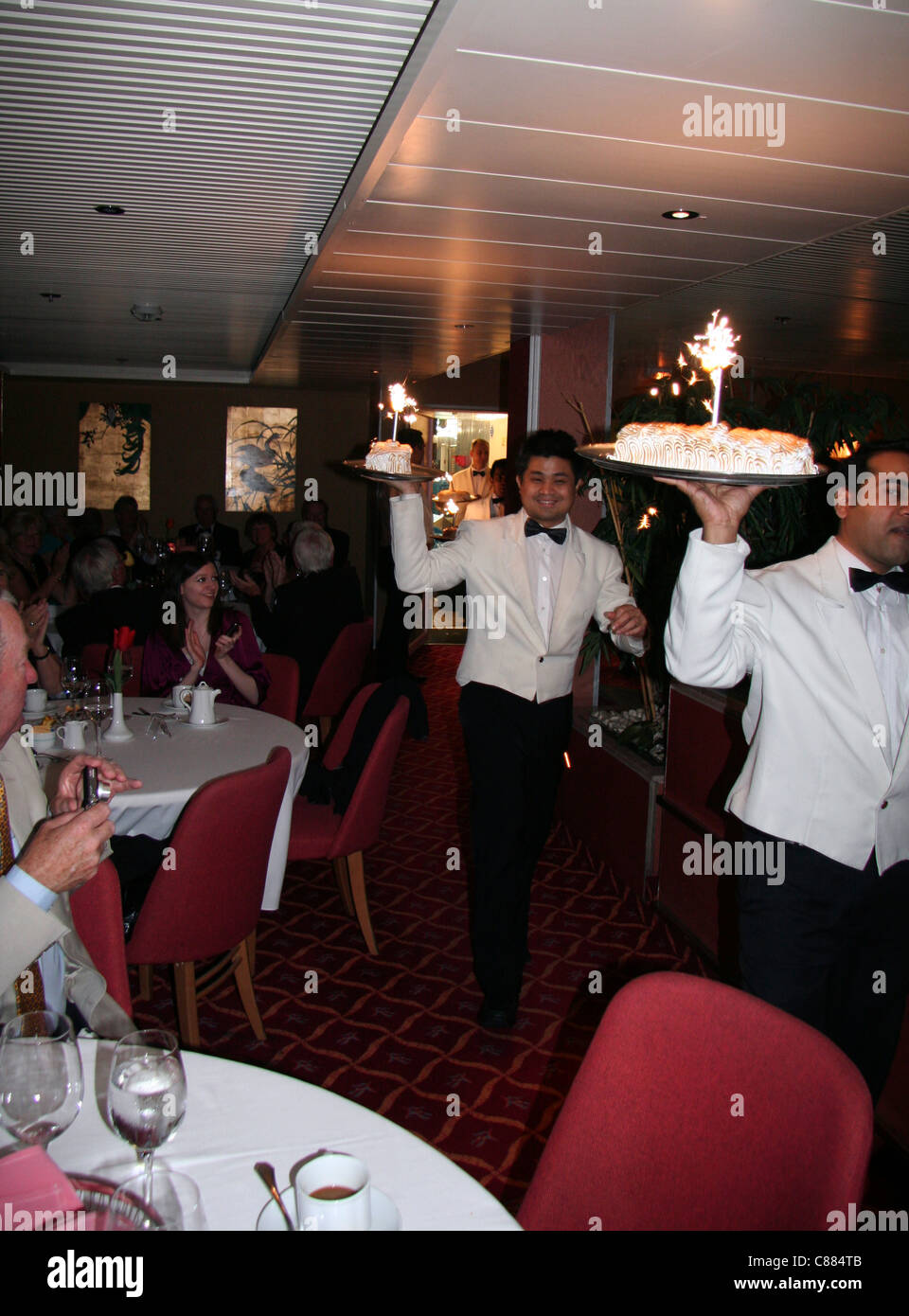 Waiter with baked alaska and sparkler Captain s dinner aboard a cruise ship Stock Photo Alamy