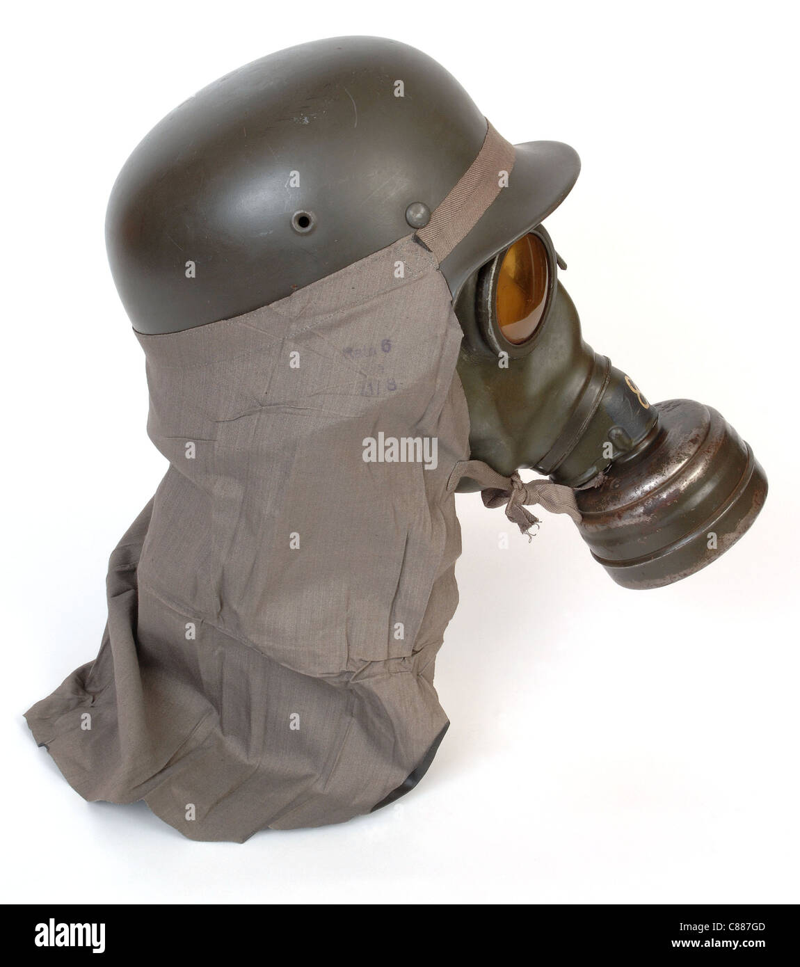 German gas mask M38 and anti gas neck shield worn with combat helmet M40 from the second world war. Stock Photo