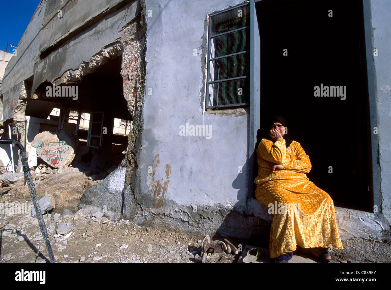 Palestinian woman sitting in front of her house at Muhaiem camp, Jenin, west bank, Palestine Stock Photo