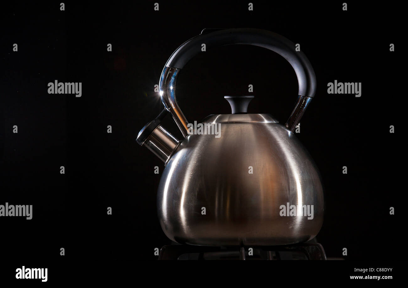 tea kettle on gas stove burner Stock Photo Alamy