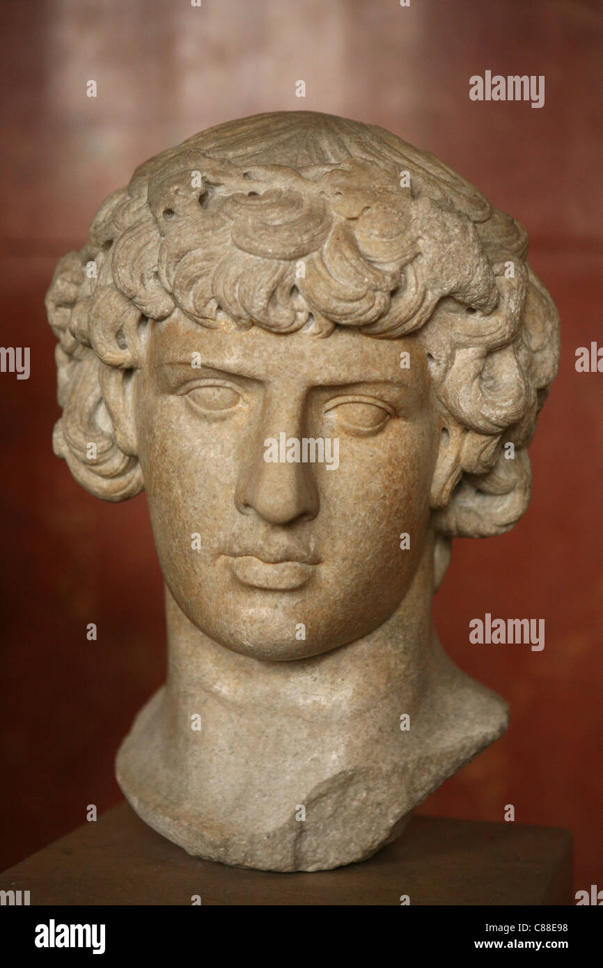 Roman marble bust of Antinous as Dionysus from ca. 130 AD on display in the Louvre Museum in Paris, France. Stock Photo