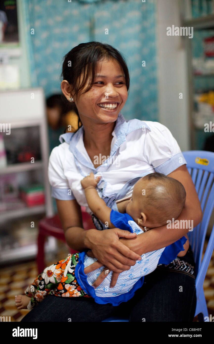 A woman breastfeeds her child at a reproductive health clinic in