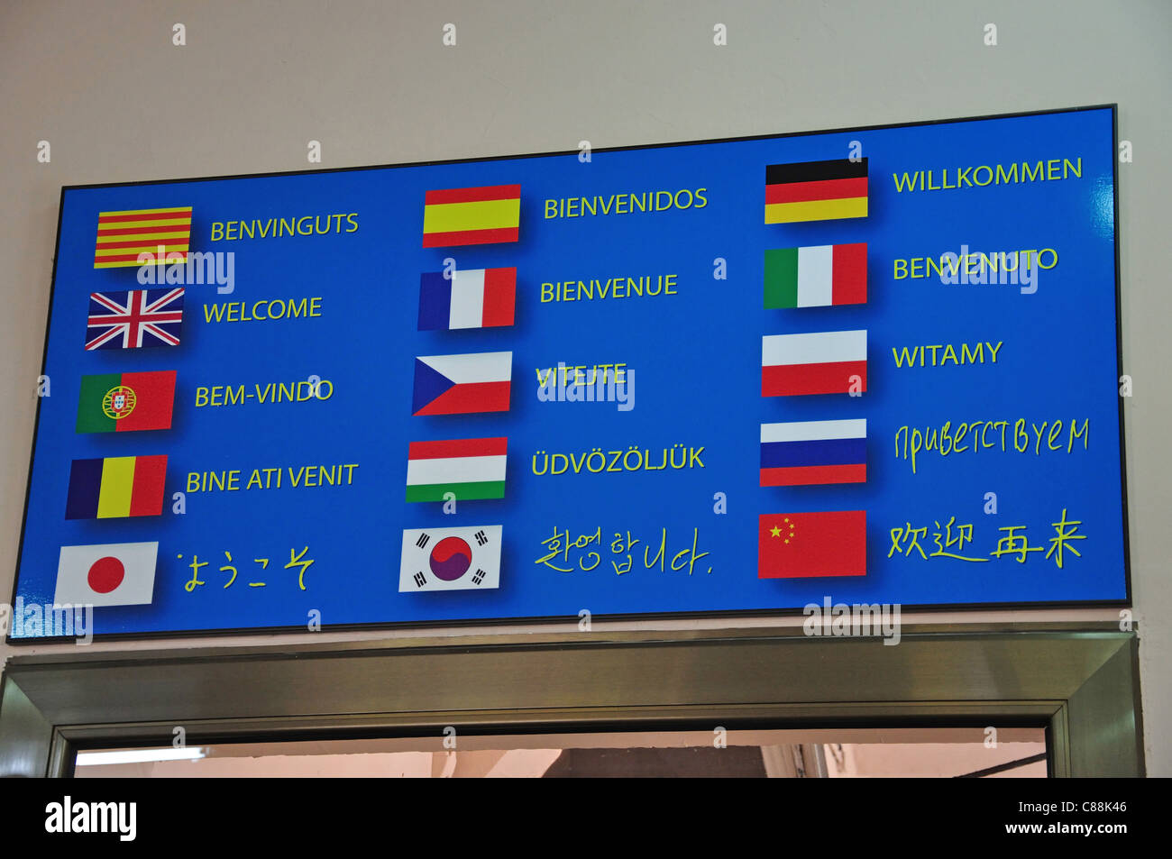 Welcome board in main languages in Teleferic de Montserrat terminal, Montserrat, Province of Barcelona, Catalonia, Spain Stock Photo