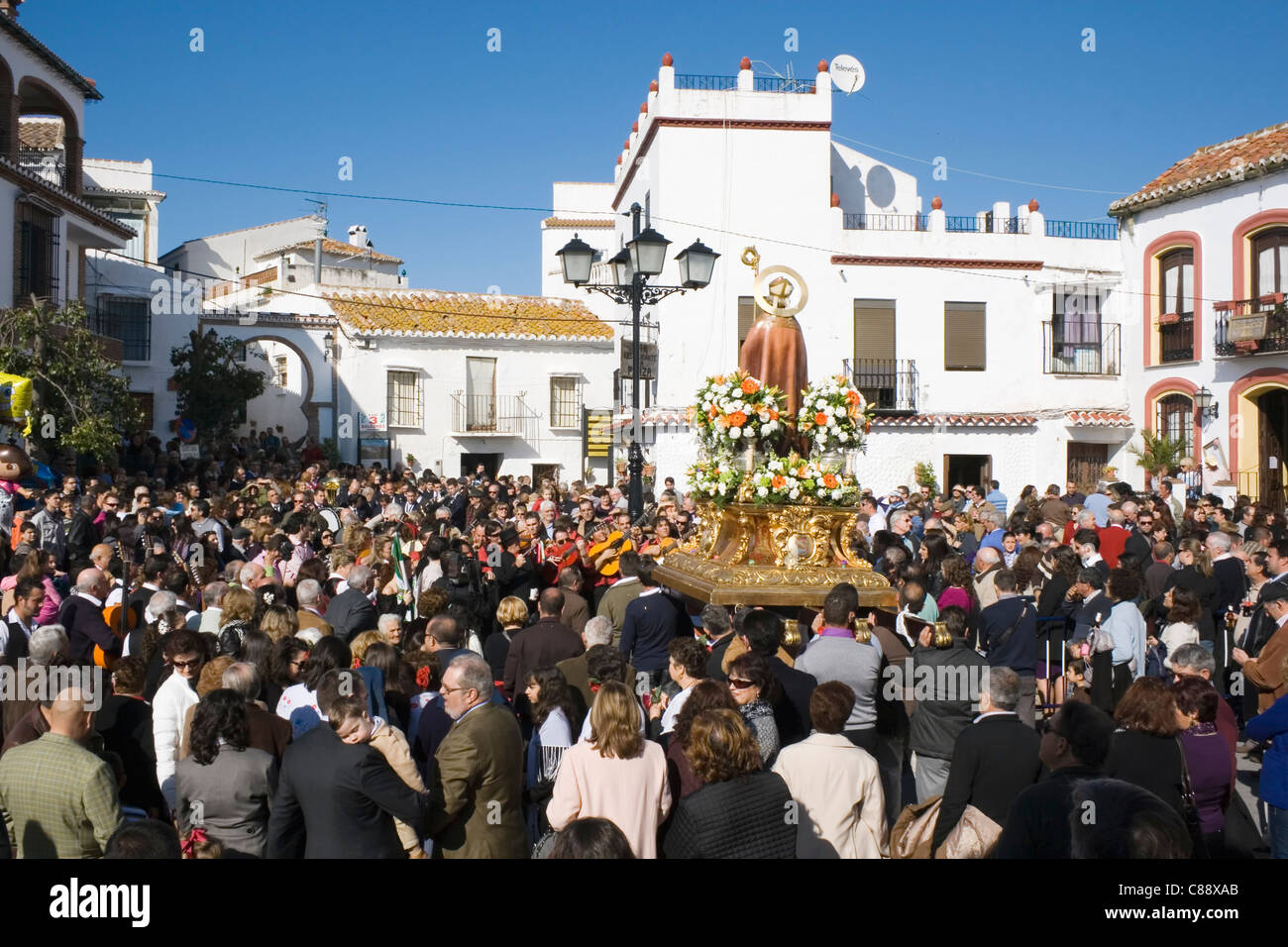 Celebration of the saint's day San Hilario de Poitiers, villagers carrying the saint on their shoulders around the village. Stock Photo