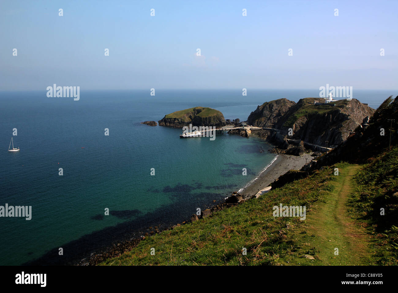 View of Rat Island, Quay and MS Oldenburg on Lundy Island, Bristol Channel, UK Stock Photo