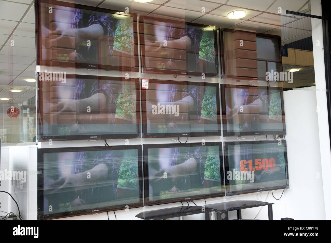 array of large screen televisions for sale in an electrical shop belfast city centre northern ireland uk Stock Photo
