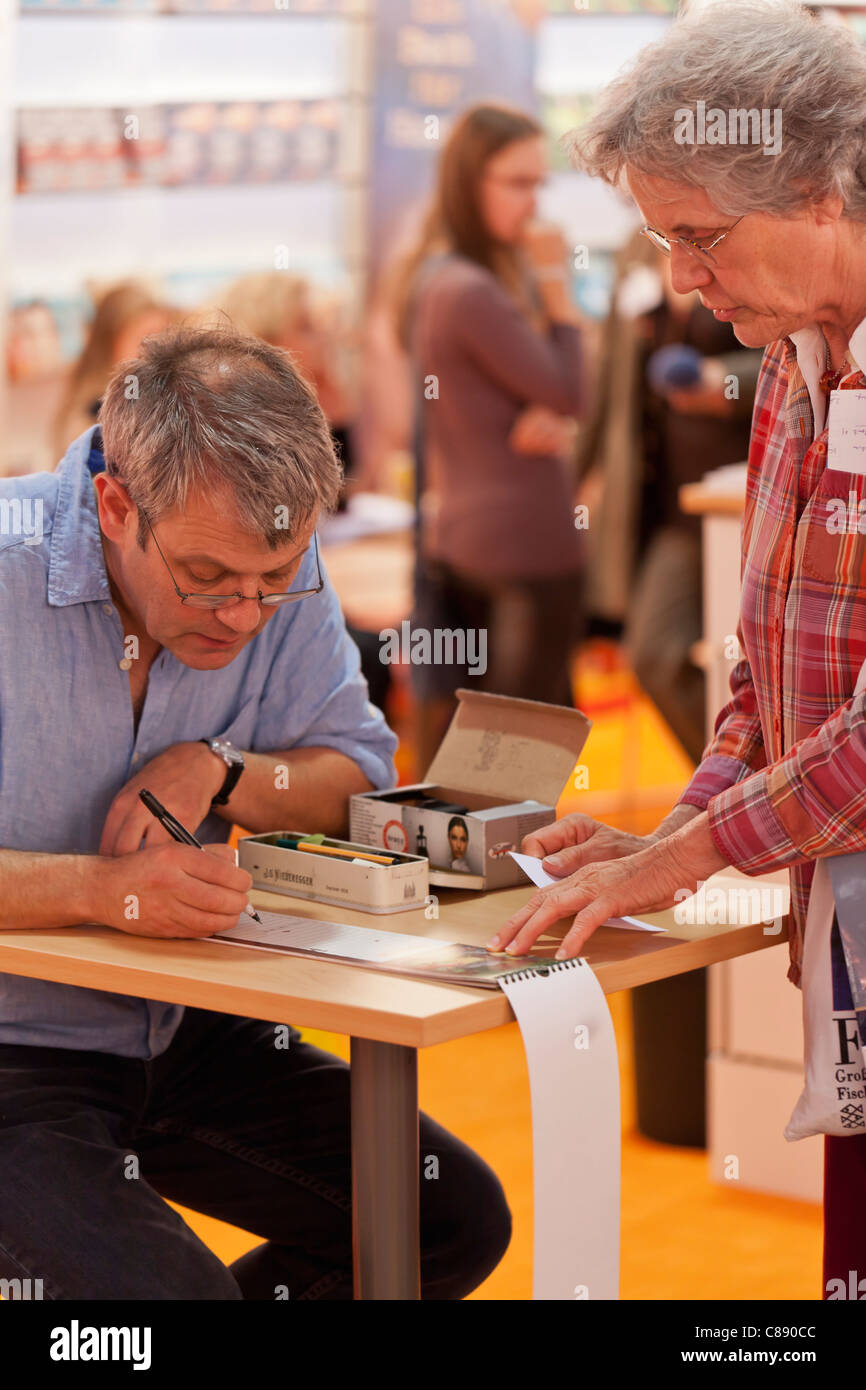 Axel Scheffler signing calendars at the Frankfurt book fair 2011 Stock Photo