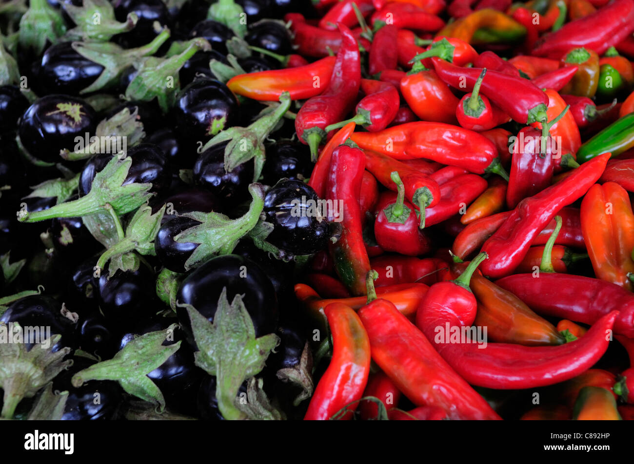 Chillies and Aubergines, Souk el Ahad, Agadir, Morocco Stock Photo