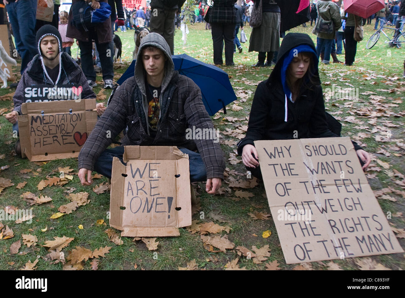 Toronto Ontario, Canada - October 15, 2011. The Occupy Wall Street movement emerged in a number of Canadian cities on Saturday. In Toronto a crowd that grew to 3000 gathered at King and Bay then marched and occupied St. James Park. Stock Photo